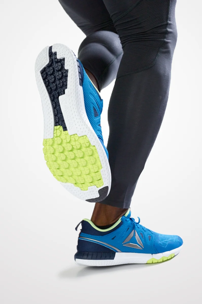Athletic running shoe on foot, directed product photography