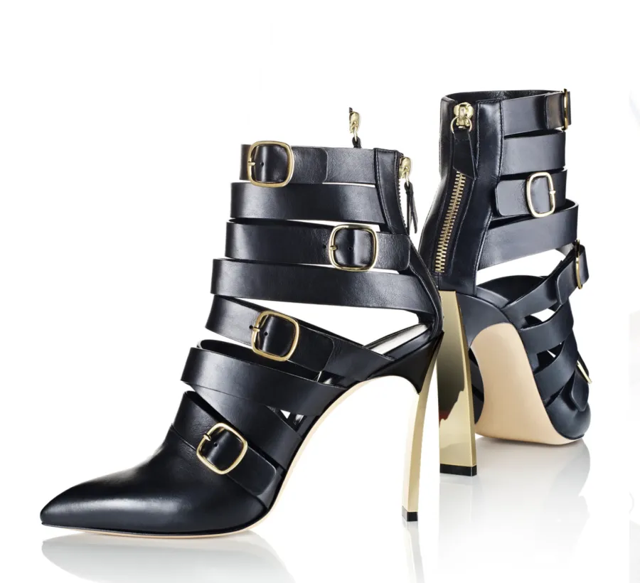 Black strappy buckled ankle boots, directed product photography