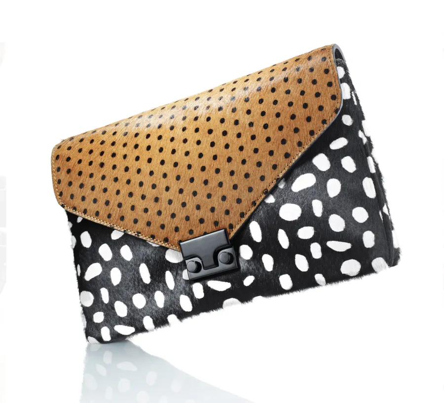 Black and white polka dot envelope clutch, directed product photography