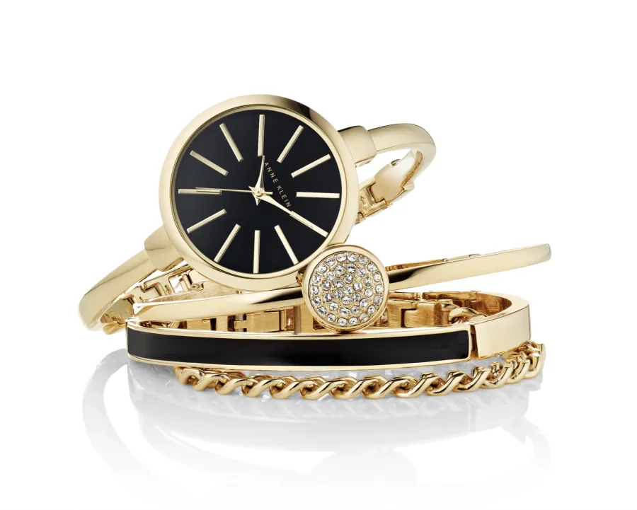 Gold and black watch and bracelet stack, directed product photography