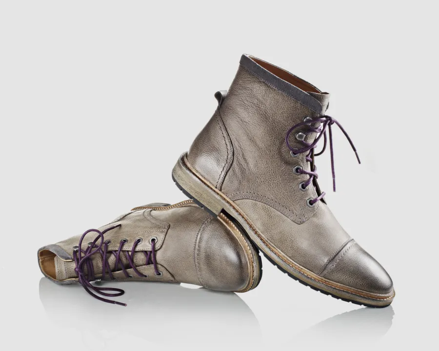 Tan lace-up boots, directed product photography