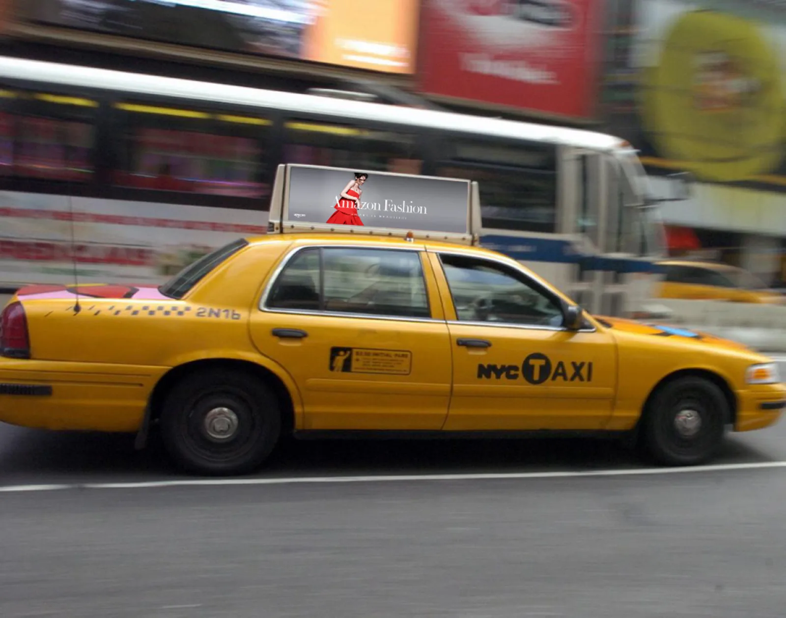 Amazon Fashion taxi-top ad on a moving NYC cab, Times Square billboards behind it