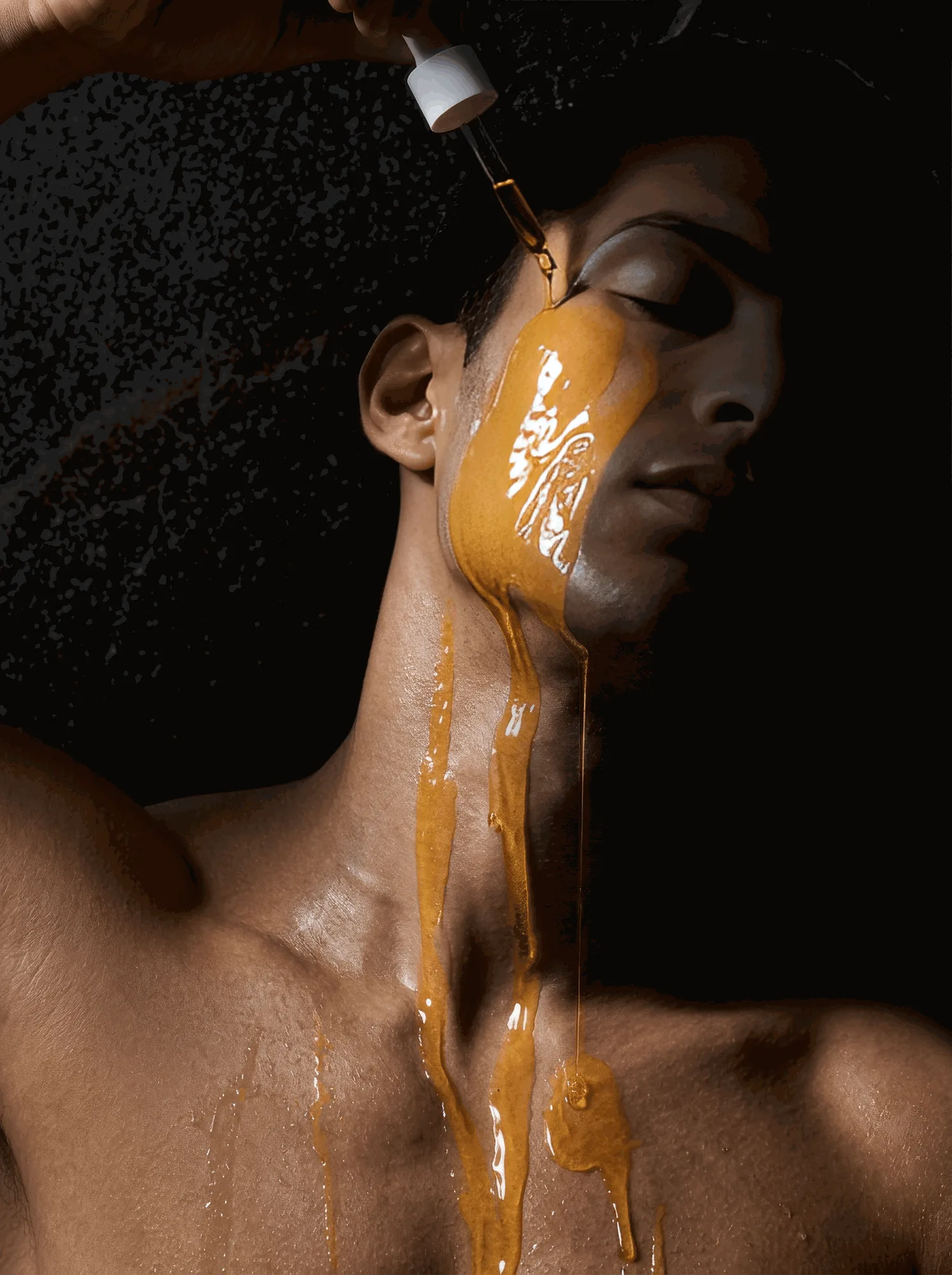 DADDY JO editorial — serum drawn from a dropper, running down the face, neck and chest